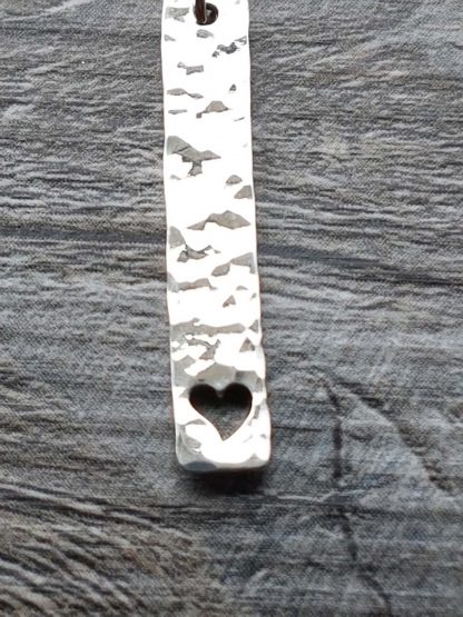 Heart cut out pendant close up