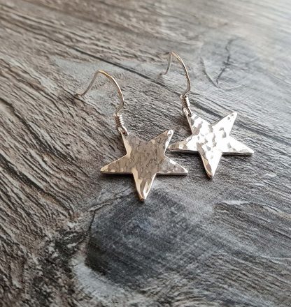 Large hammered star earrings