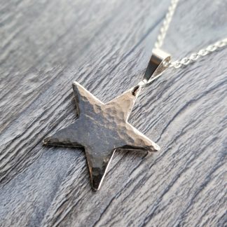 Large hammered star pendant