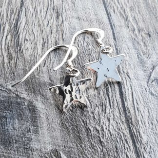 Small hammered star earrings